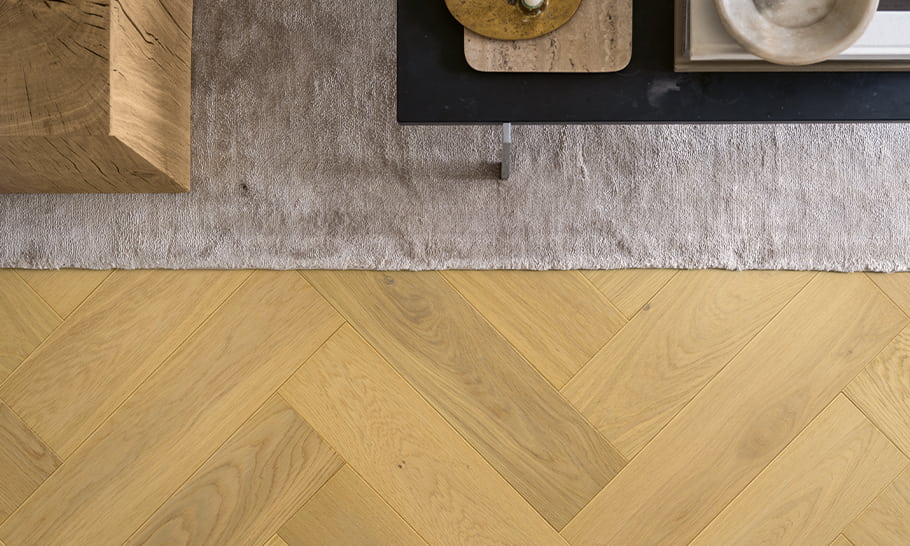 detailed image of beige parquet herringbone floor